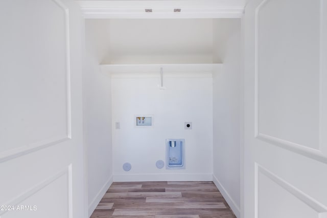 washroom with gas dryer hookup, laundry area, hookup for a washing machine, wood finished floors, and electric dryer hookup