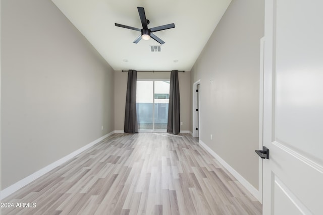 unfurnished room with light wood-type flooring, visible vents, baseboards, and a ceiling fan