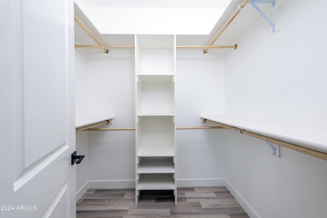 spacious closet with light wood finished floors