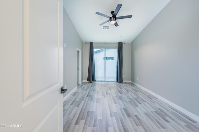 unfurnished room with visible vents, baseboards, light wood-style floors, and a ceiling fan