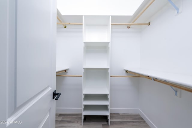 spacious closet with wood finished floors