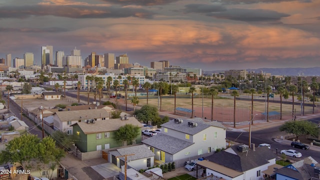 aerial view at dusk featuring a view of city