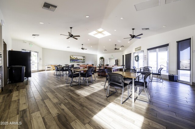 dining area with a wealth of natural light and vaulted ceiling