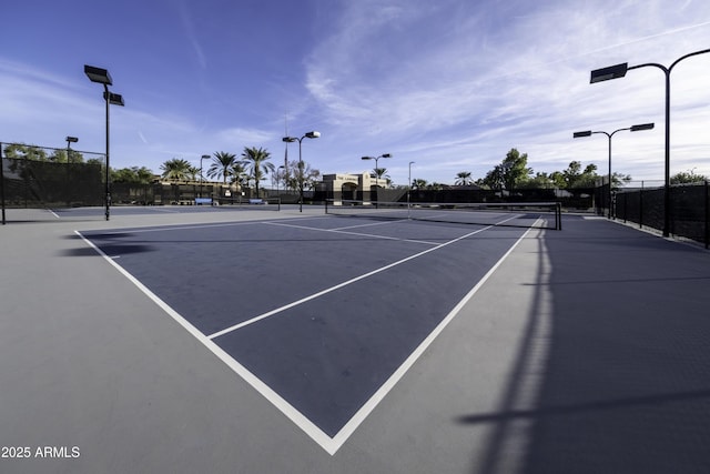 view of tennis court featuring basketball court