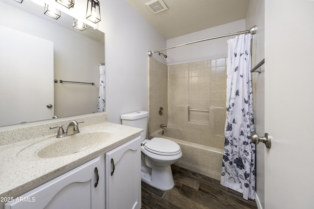 full bathroom featuring shower / bath combo with shower curtain, vanity, wood-type flooring, and toilet