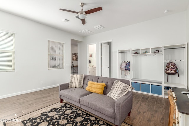 9764 E Thornbush Ave, Mesa, AZ 85212 - living room featuring dark wood-type flooring, ceiling fan, and baseboards