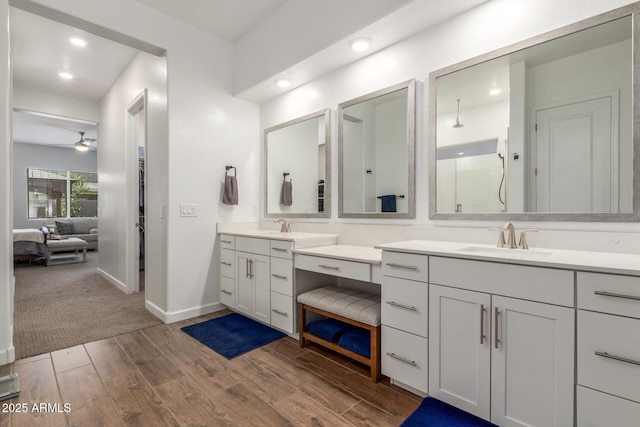 9764 E Thornbush Ave, Mesa, AZ 85212 - ensuite bathroom with vanity, a walk in shower, wood finished floors, recessed lighting, and baseboards