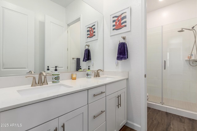 9764 E Thornbush Ave, Mesa, AZ 85212 - full bath with double vanity, a shower stall, wood finished floors, and toilet
