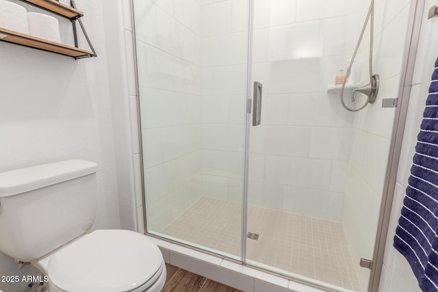 9764 E Thornbush Ave, Mesa, AZ 85212 - bathroom with toilet, a stall shower, and wood finished floors