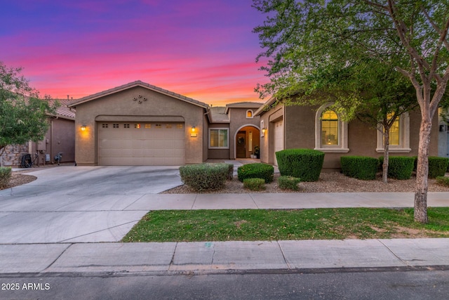 9764 E Thornbush Ave, Mesa, AZ 85212 - view of front of house with a garage, concrete driveway, and stucco siding
