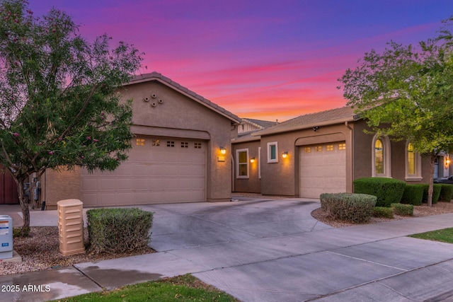 9764 E Thornbush Ave, Mesa, AZ 85212 - view of front of property featuring an attached garage, concrete driveway, and stucco siding
