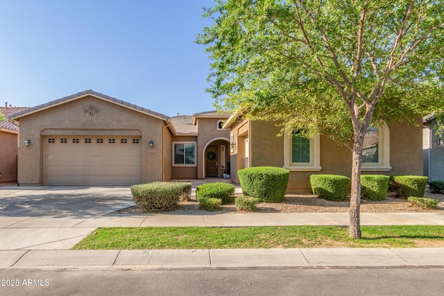 9764 E Thornbush Ave, Mesa, AZ 85212 - view of front of property featuring an attached garage, stucco siding, a tile roof, and driveway