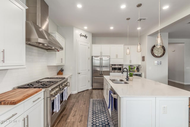 9764 E Thornbush Ave, Mesa, AZ 85212 - kitchen with premium appliances, a sink, wall chimney range hood, light countertops, and backsplash