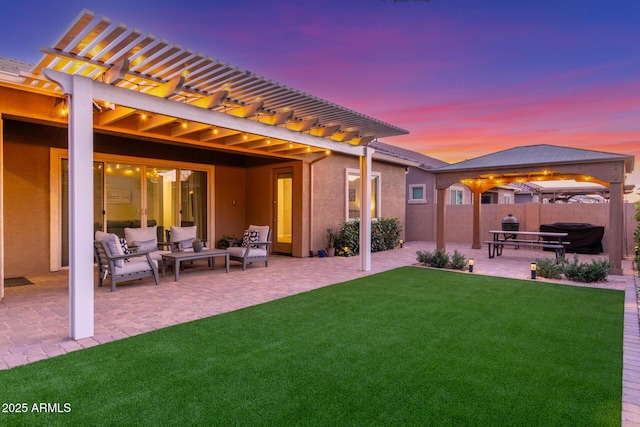 9764 E Thornbush Ave, Mesa, AZ 85212 - back of property at dusk featuring a pergola, a patio area, an outdoor living space, stucco siding, and a gazebo