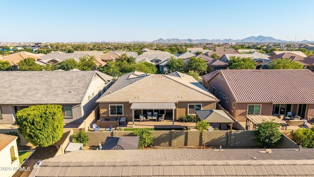 9764 E Thornbush Ave, Mesa, AZ 85212 - aerial perspective of suburban area featuring a mountainous background