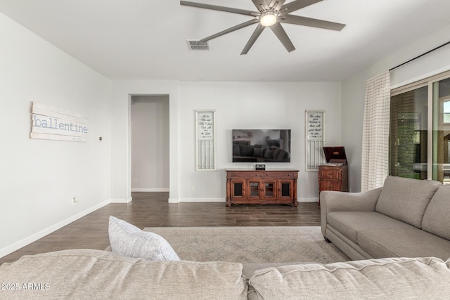9764 E Thornbush Ave, Mesa, AZ 85212 - living area with dark wood-style flooring, ceiling fan, and baseboards