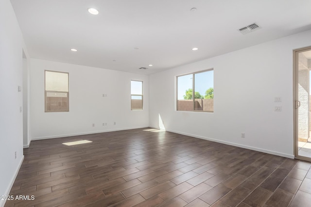11627 W Green Dr, Youngtown, AZ 85363 - unfurnished room with dark wood-type flooring, recessed lighting, and baseboards