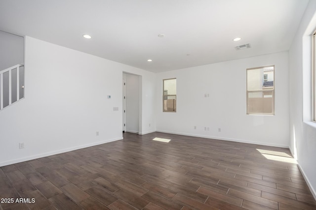 11627 W Green Dr, Youngtown, AZ 85363 - spare room with dark wood finished floors, baseboards, and recessed lighting