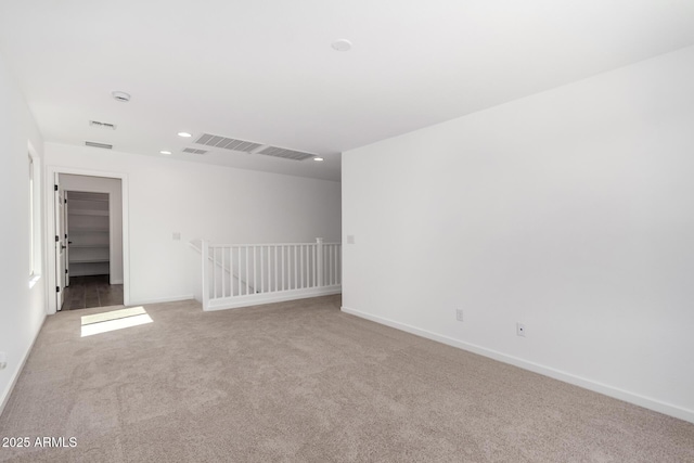 11627 W Green Dr, Youngtown, AZ 85363 - carpeted empty room with baseboards and recessed lighting