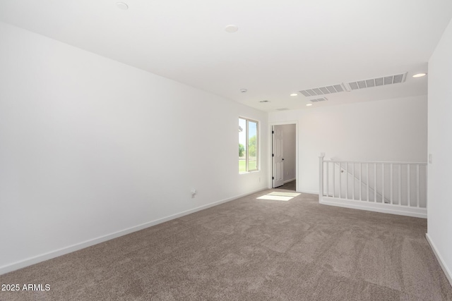 11627 W Green Dr, Youngtown, AZ 85363 - empty room with carpet floors, baseboards, and recessed lighting