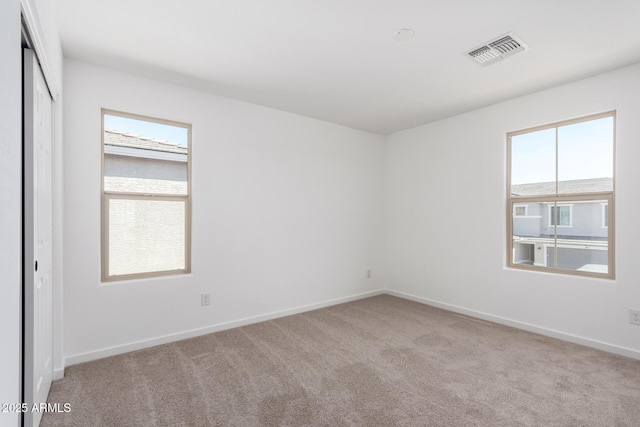 11627 W Green Dr, Youngtown, AZ 85363 - spare room with carpet floors and baseboards