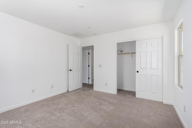 11627 W Green Dr, Youngtown, AZ 85363 - unfurnished bedroom with carpet flooring, baseboards, and a closet