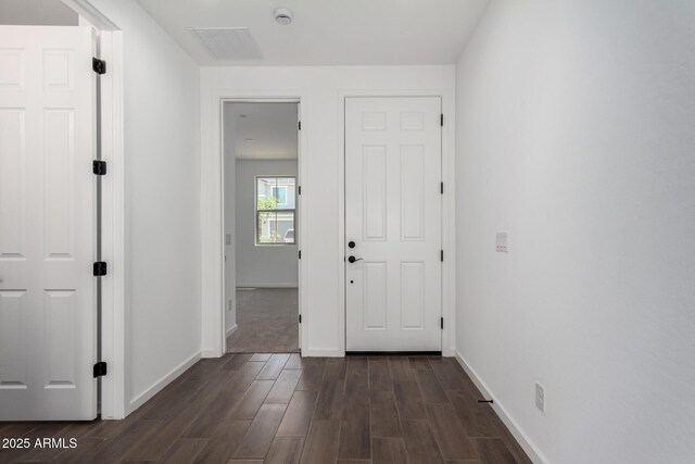 11627 W Green Dr, Youngtown, AZ 85363 - hallway featuring dark wood finished floors and baseboards