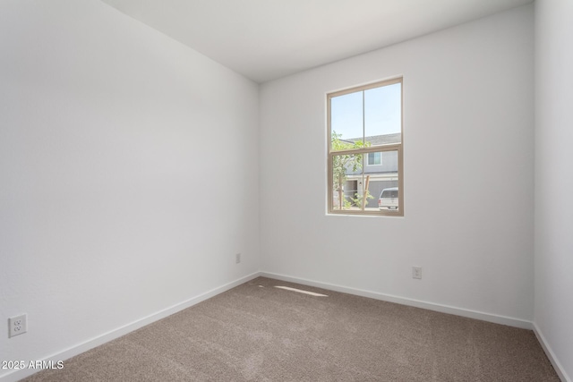 11627 W Green Dr, Youngtown, AZ 85363 - carpeted empty room with baseboards