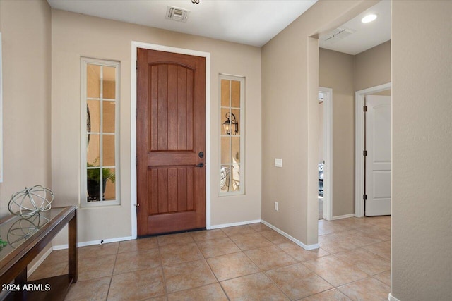 entrance foyer with light tile patterned floors