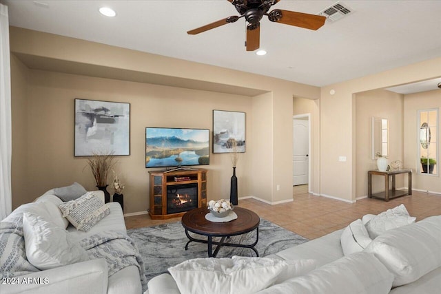 tiled living room with ceiling fan