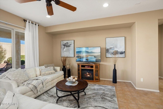 tiled living room with ceiling fan