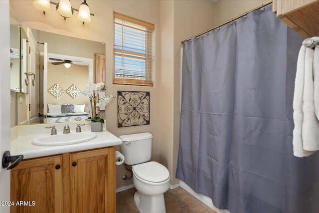 bathroom featuring ceiling fan, tile patterned flooring, vanity, and toilet