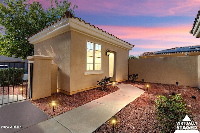 view of property exterior at dusk