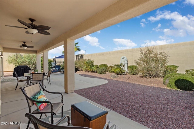 view of patio / terrace with ceiling fan and a grill