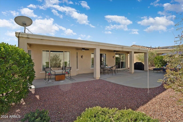 back of house featuring ceiling fan and a patio area