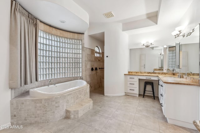 bathroom featuring tile patterned floors, plus walk in shower, and vanity