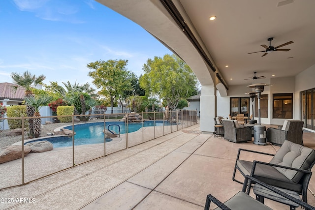 view of pool with a patio, an outdoor hangout area, and ceiling fan