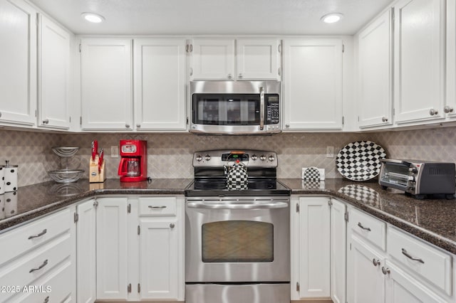 kitchen featuring white cabinets and appliances with stainless steel finishes