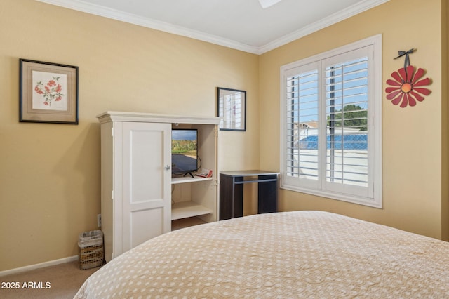 bedroom featuring carpet flooring, baseboards, and ornamental molding