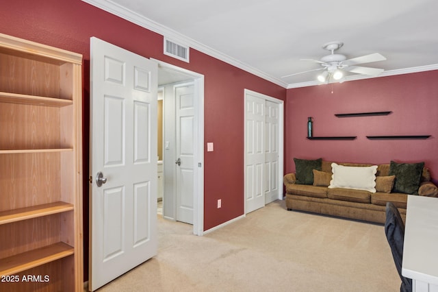 living room with a ceiling fan, baseboards, visible vents, light carpet, and crown molding