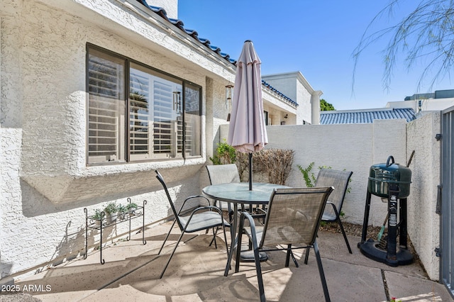 view of patio / terrace with grilling area, fence private yard, and outdoor dining space