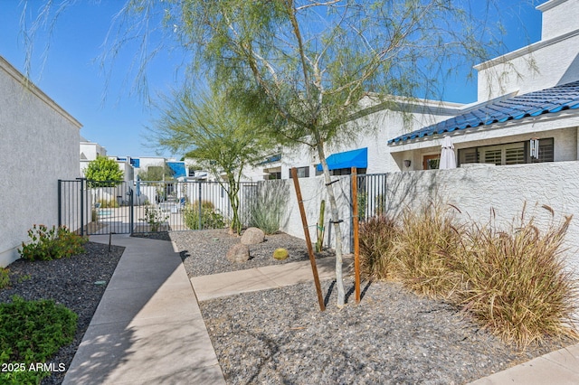 view of yard featuring fence private yard and a gate