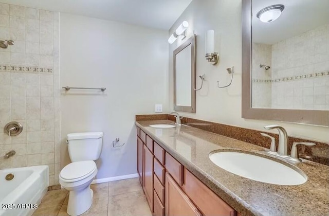 full bath featuring tile patterned flooring, double vanity, toilet, and a sink