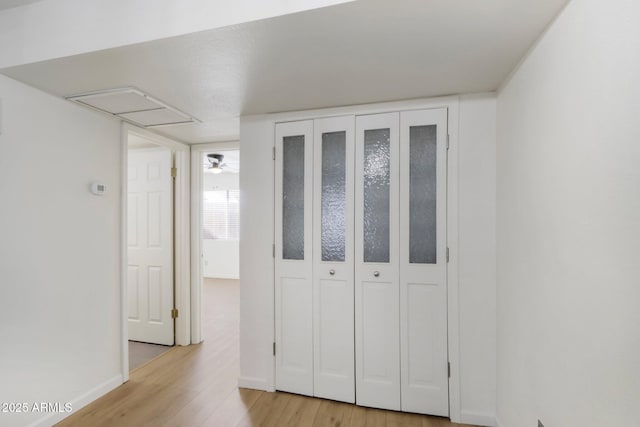 unfurnished bedroom featuring baseboards and light wood-style floors