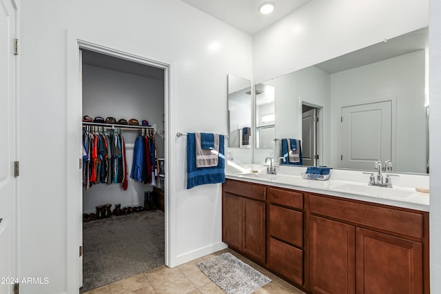 bathroom with tile patterned floors and vanity