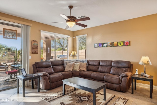 living room with ceiling fan and light tile patterned floors