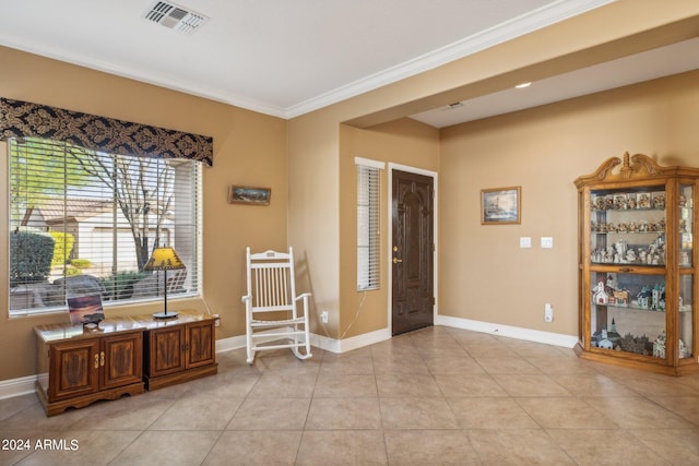 tiled entryway with ornamental molding