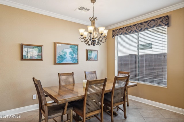 tiled dining area featuring crown molding and an inviting chandelier