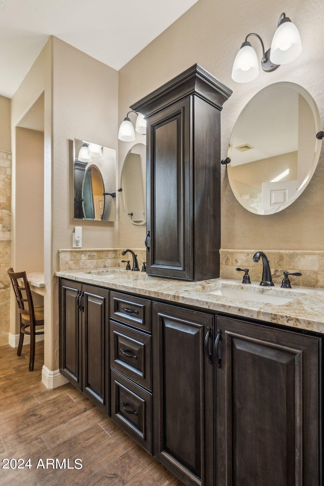 bathroom with wood-type flooring and vanity