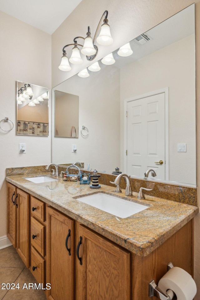 bathroom featuring tile patterned floors and vanity